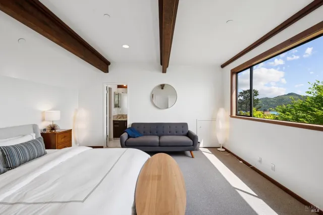 a bedroom with a bed and window