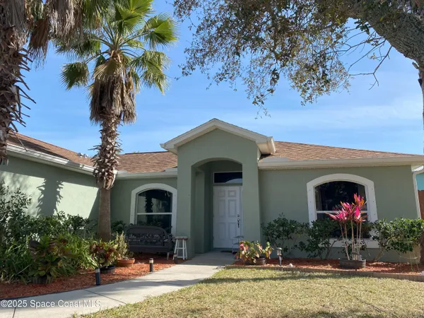 a front view of a house with yard