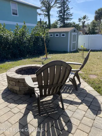 a view of a chairs and table in the patio