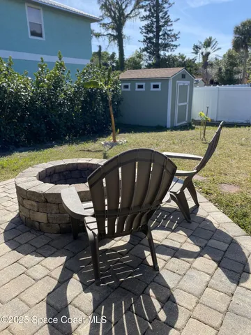 a view of a chairs and table in the patio