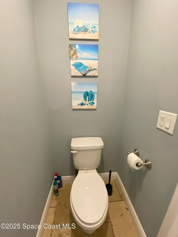 a bathroom with a toilet and a vanity