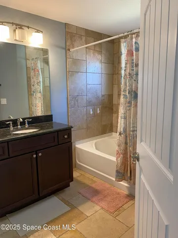 a bathroom with a bathtub and a sink