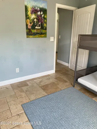 a view of a livingroom with furniture and a flat screen tv