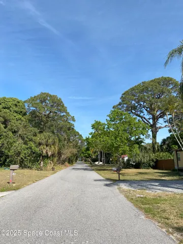 a view of a road with a yard