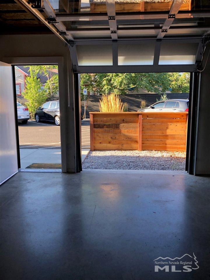 339 South Wells Avenue Reno, NV 89502 - Photo 14 of 20 a view of empty room with floor to ceiling window and wooden floor
