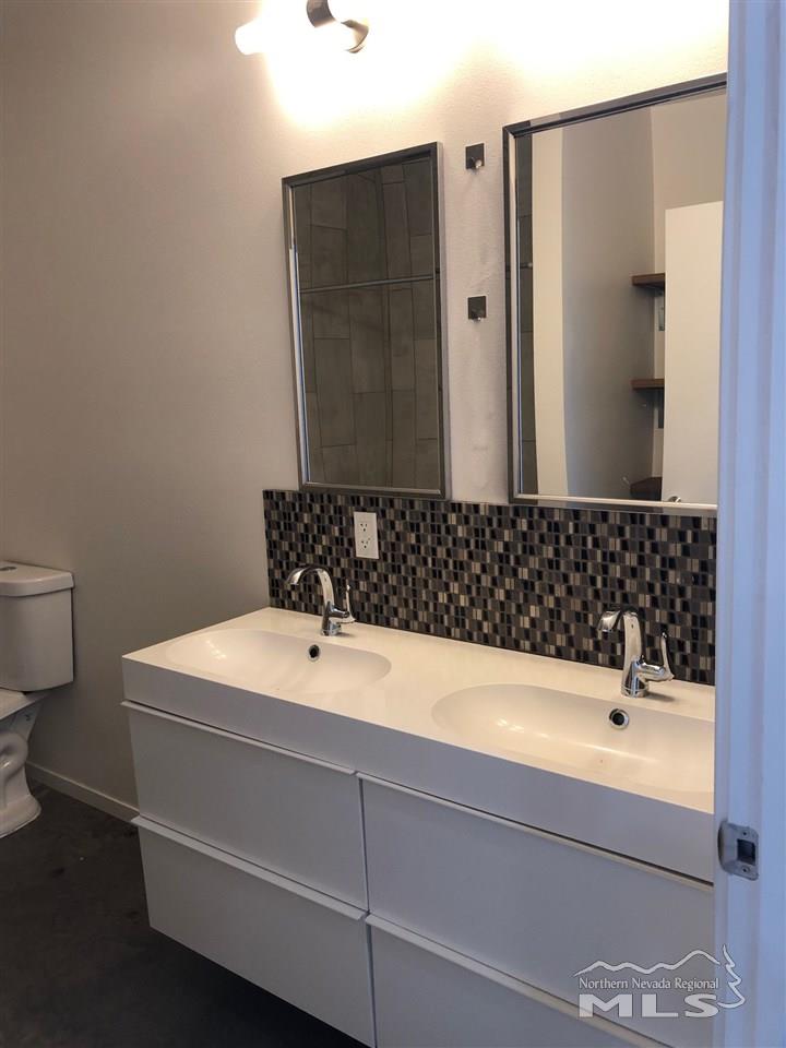 339 South Wells Avenue Reno, NV 89502 - Photo 16 of 20 a bathroom with a sink and a mirror