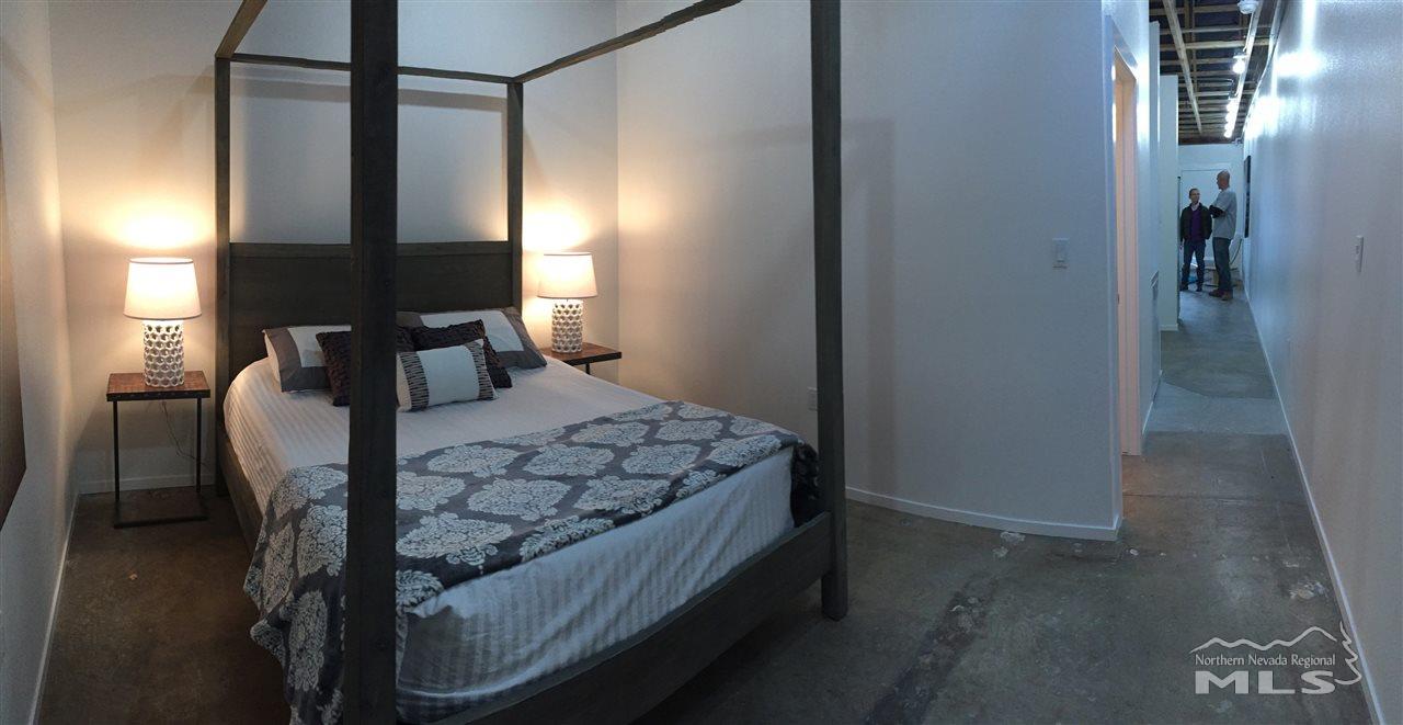 339 South Wells Avenue Reno, NV 89502 - Photo 9 of 20 a bedroom with a bed a table and chair