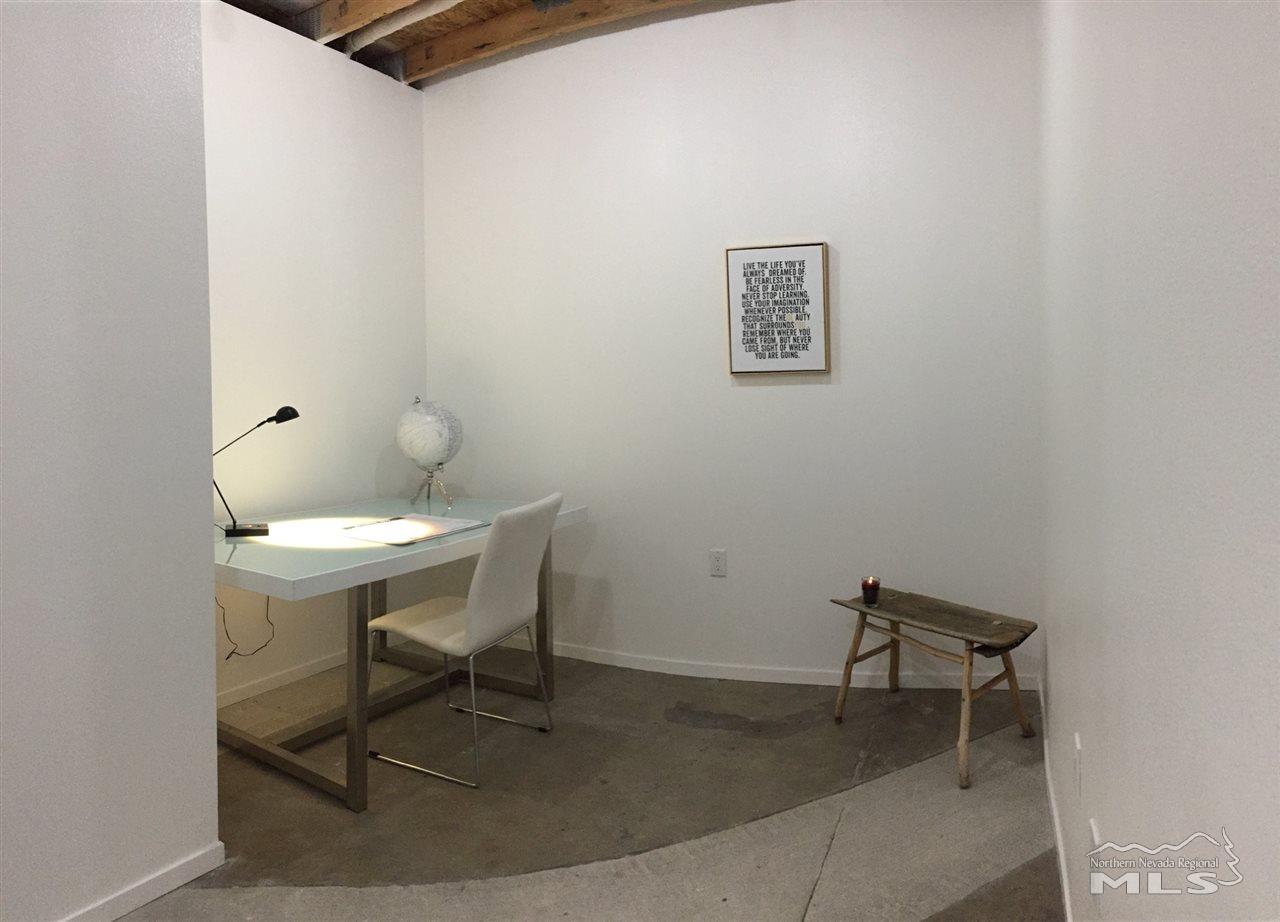 339 South Wells Avenue Reno, NV 89502 - Photo 10 of 20 a chair and a table in a room