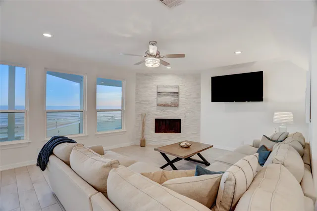 a view of a living room with wooden floor