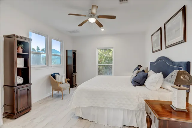a bedroom with furniture and a window