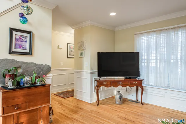 a view of a dining room with furniture and a window