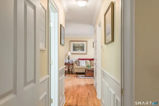 a bedroom with a bed and a chandelier fan