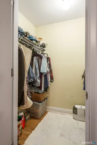 a bathroom with a toilet a sink and a shower curtain