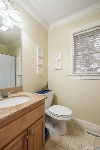 a view of a balcony with furniture and window