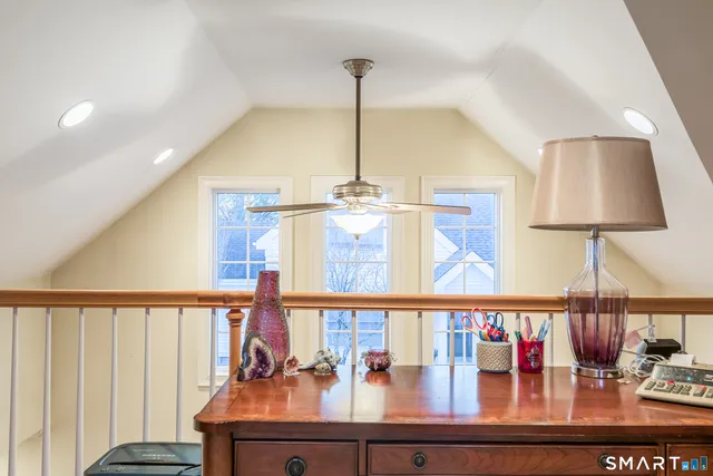 a view of a patio with table and chairs potted plants