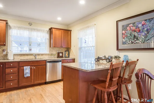 a large kitchen with dining table and chairs