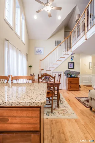 a living room with lots of furniture and a wooden floor