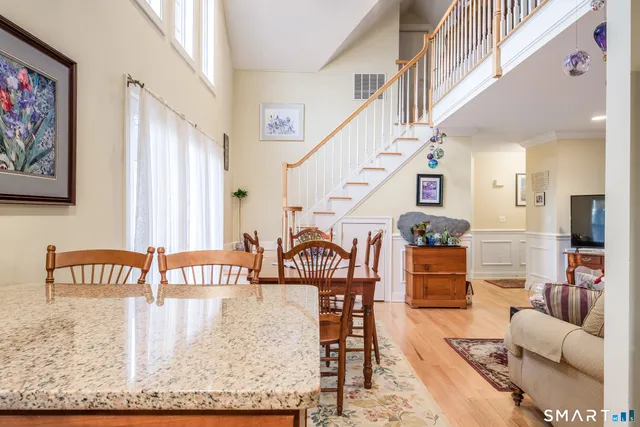 a living room with furniture and kitchen view