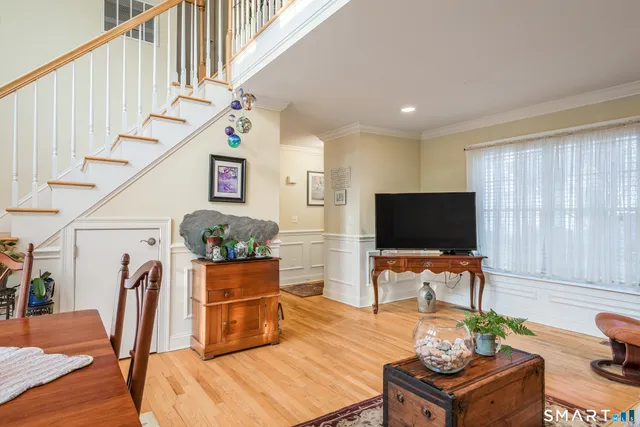 a living room with furniture and flat screen tv
