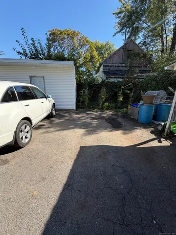 a view of a backyard with a car parked