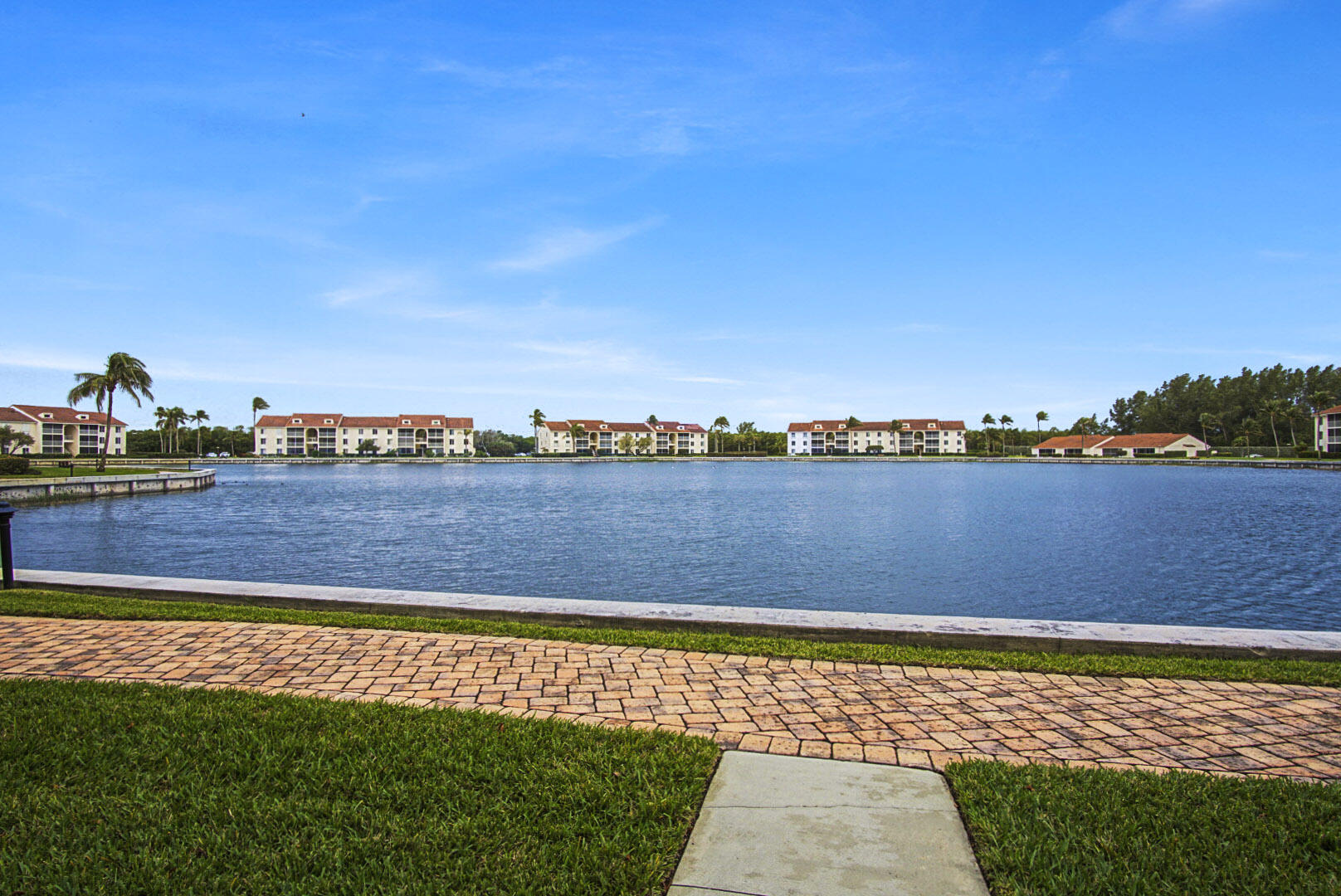 4428 Northeast Ocean Boulevard, Unit G1 Jensen Beach, FL 34957 - Photo 21 of 28 a view of a swimming pool and an outdoor seating