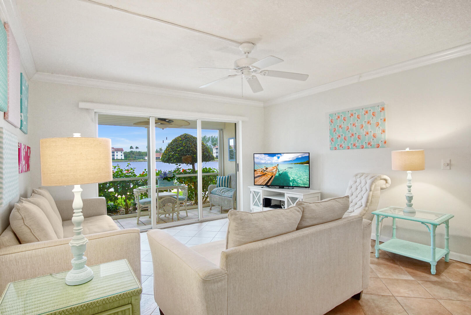 4428 Northeast Ocean Boulevard, Unit G1 Jensen Beach, FL 34957 - Photo 7 of 28 a living room with furniture and a flat screen tv