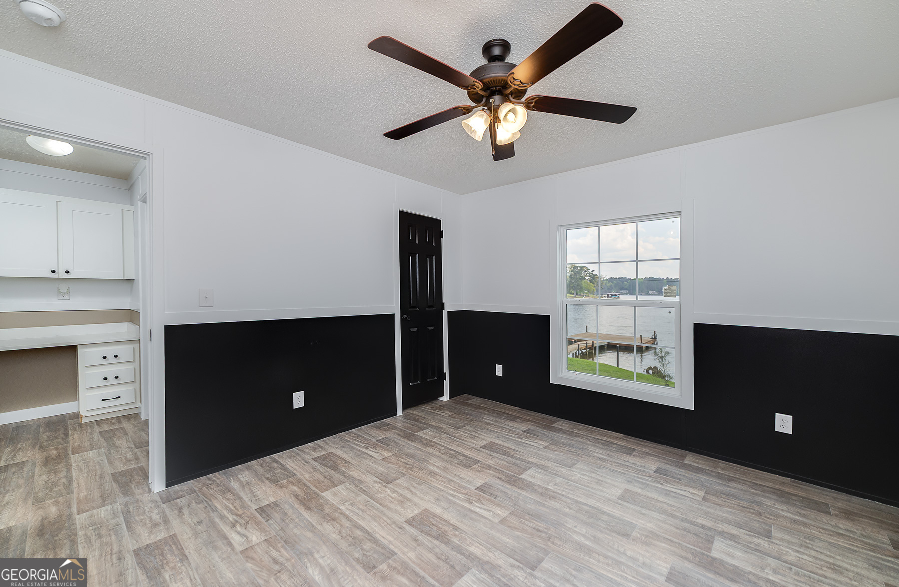 595 Barnetts Bridge Road Jackson, GA 30233 - Photo 35 of 47 a bedroom with a bed and a ceiling fan