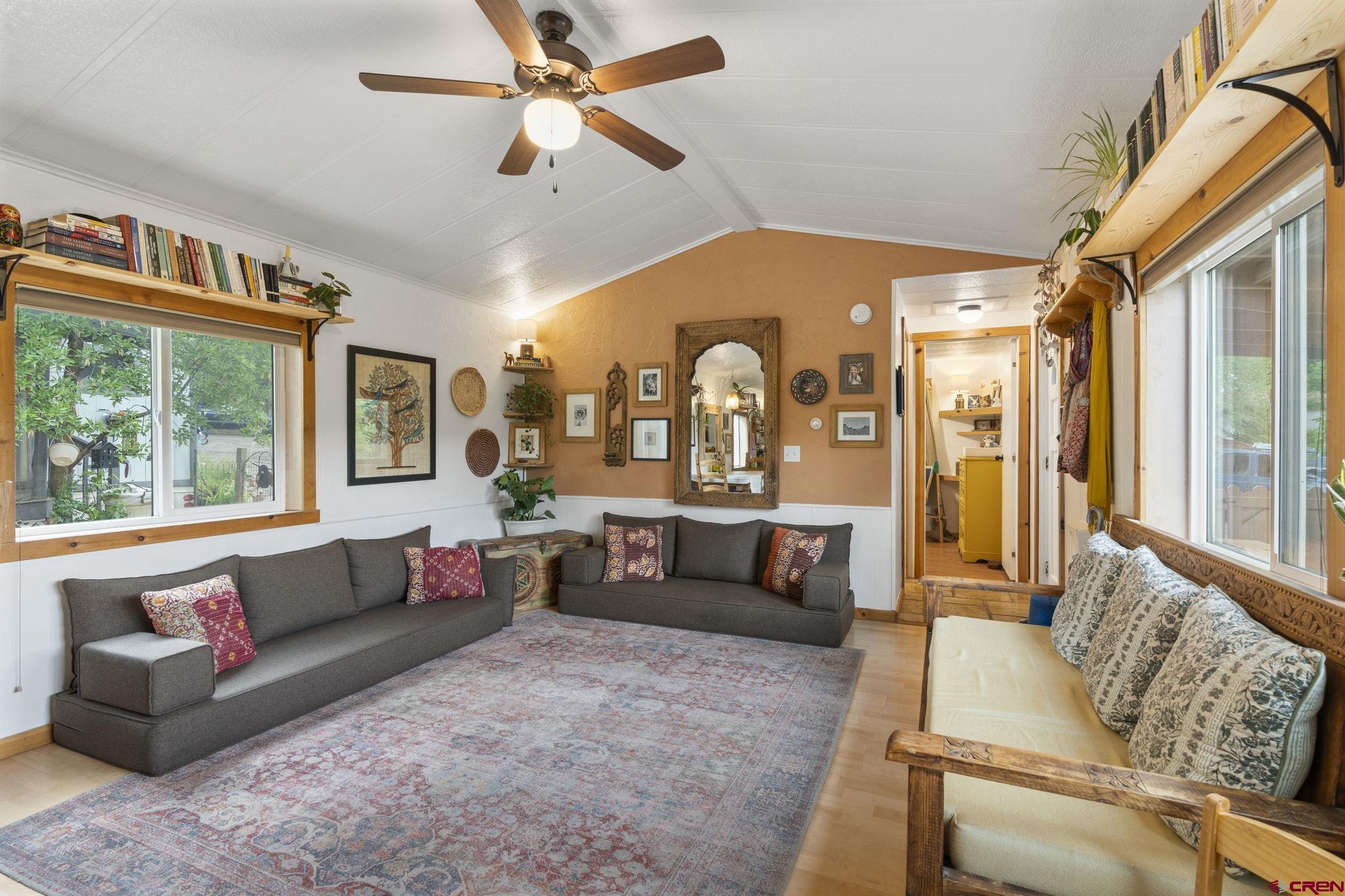 288 Animas View Drive, Unit 87 Durango, CO 81301 - Photo 13 of 27 a living room with furniture and a large window
