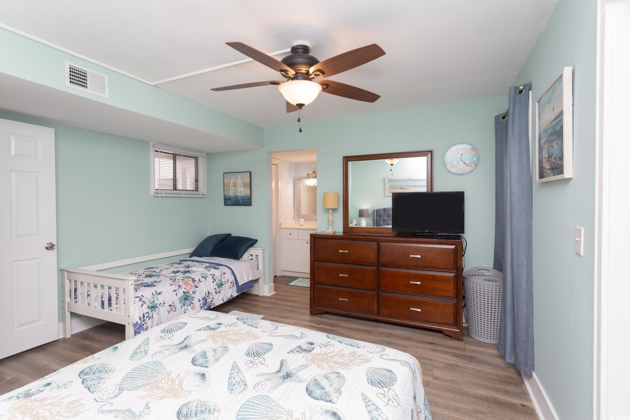351 Lake Arrowhead Road, Unit 25404 Myrtle Beach, SC 29572 - Photo 12 of 37 Bedroom featuring ceiling fan, ensuite bathroom, and hardwood / wood-style flooring