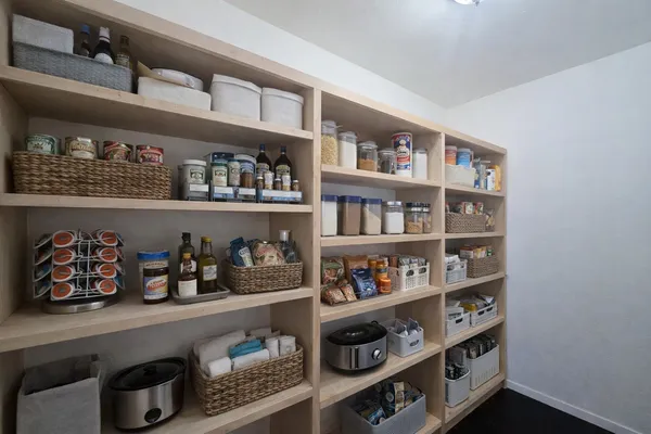 a shelf with cup and plates