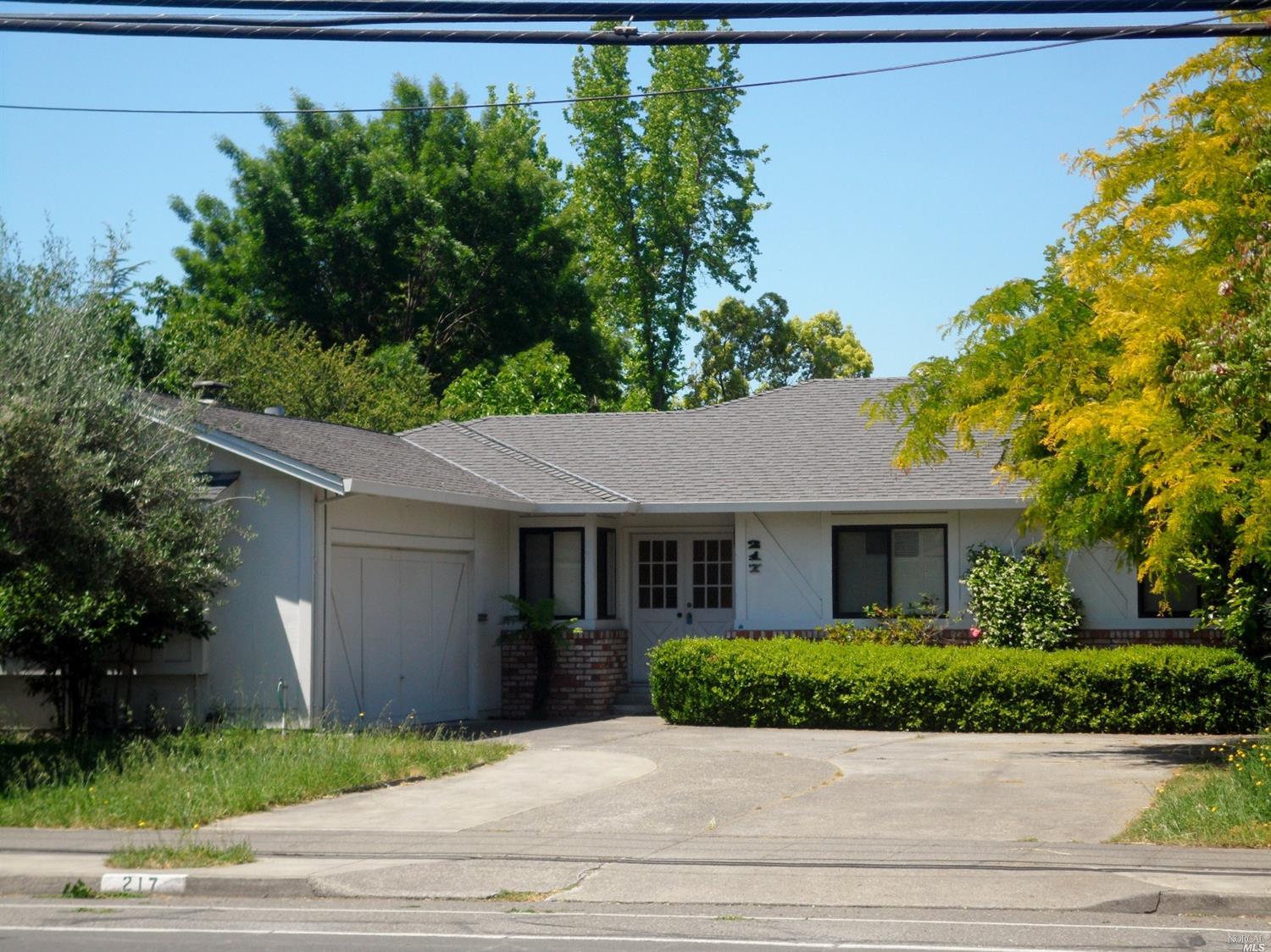 217 Calistoga Road Santa Rosa, CA 95409 - Photo 1 of 1 a front view of a house with a yard and potted plants