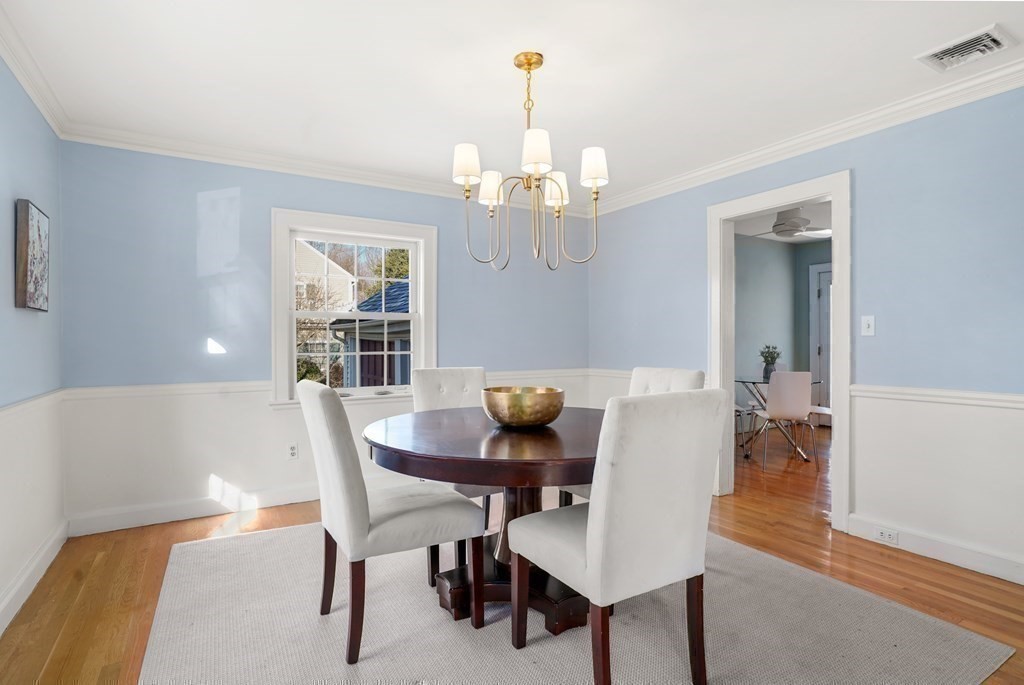 243 Rutledge Road Belmont, MA 02478 - Photo 12 of 21 a view of a dining room with furniture and wooden floor