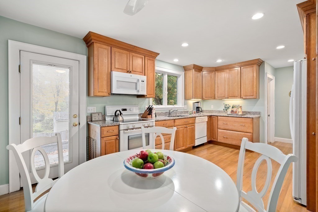 243 Rutledge Road Belmont, MA 02478 - Photo 13 of 21 a kitchen with a refrigerator and a stove top oven