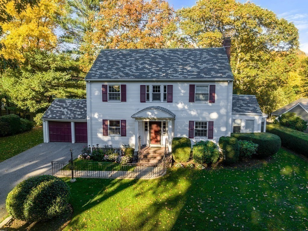 243 Rutledge Road Belmont, MA 02478 - Photo 21 of 21 a front view of a house with a garden and plants