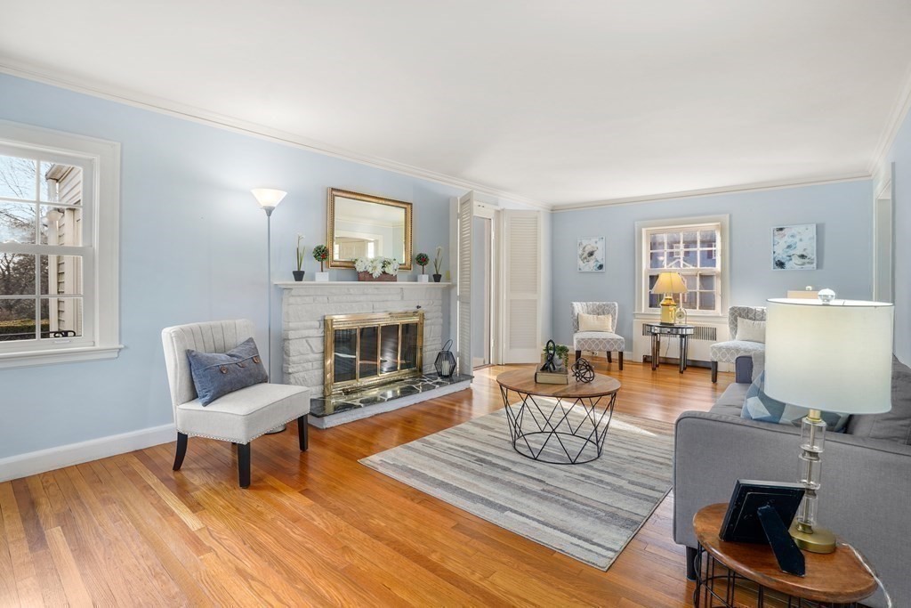 243 Rutledge Road Belmont, MA 02478 - Photo 7 of 21 a living room with furniture and a fireplace