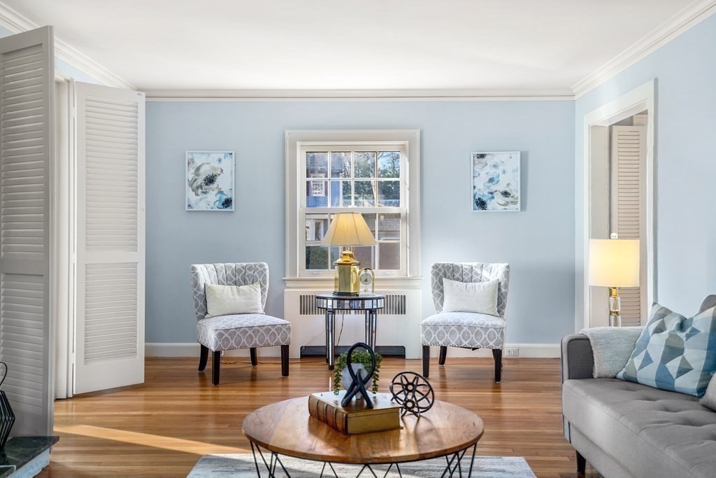 243 Rutledge Road Belmont, MA 02478 - Photo 9 of 21 a living room with furniture and a table