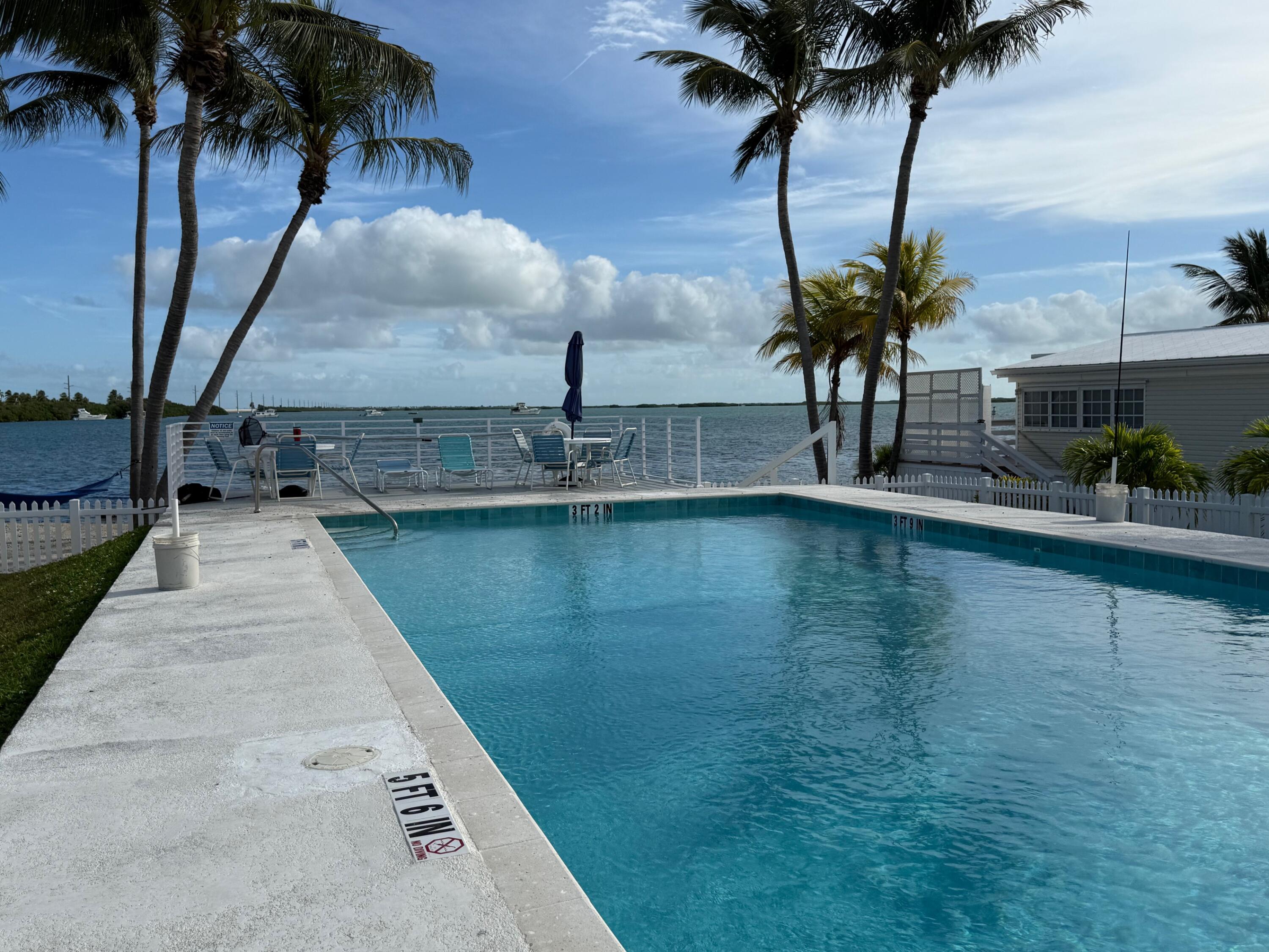 55 Boca Chica Road, Unit 57 Key West, FL 33040 - Photo 18 of 20 a view of outdoor space with seating area