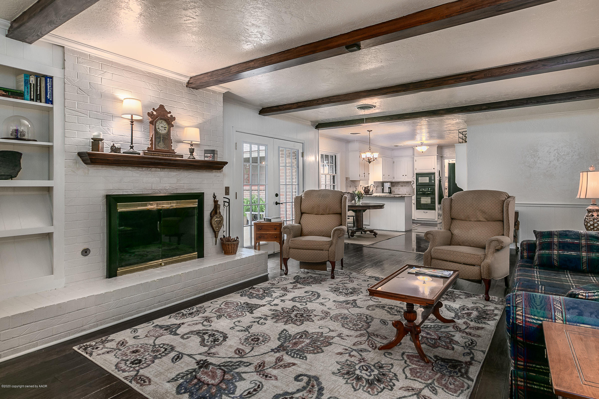 6906 Elmhurst Road Amarillo, TX 79106 - Photo 6 of 33 a living room with furniture and a fireplace