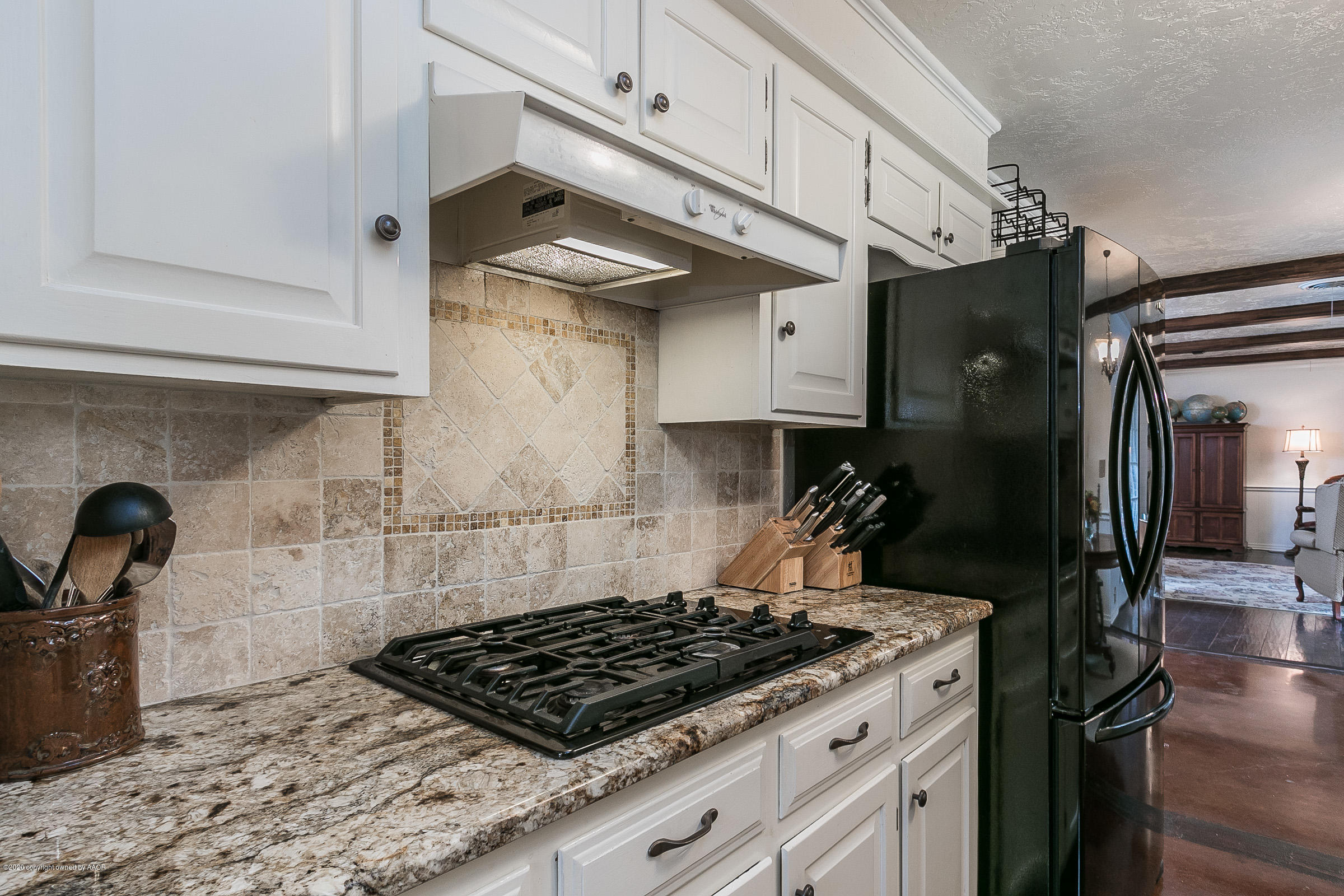 6906 Elmhurst Road Amarillo, TX 79106 - Photo 10 of 33 a kitchen with stainless steel appliances granite countertop a sink stove and cabinets
