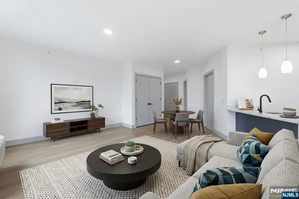 a living room with furniture and a lamp
