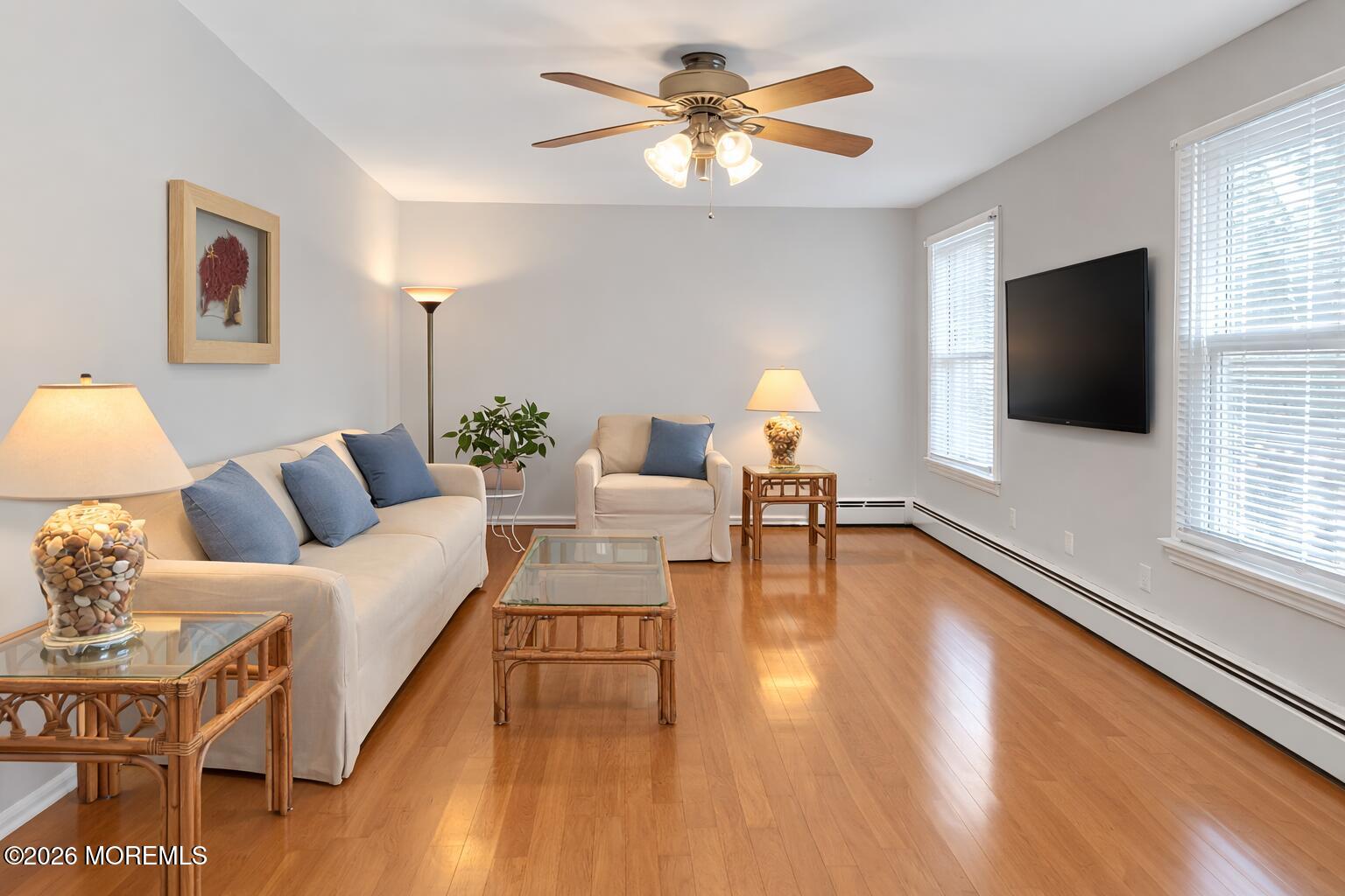 330 Highway 35, Unit 20 Point Pleasant Beach, NJ 08742 - Photo 1 of 22 a living room with furniture and a flat screen tv