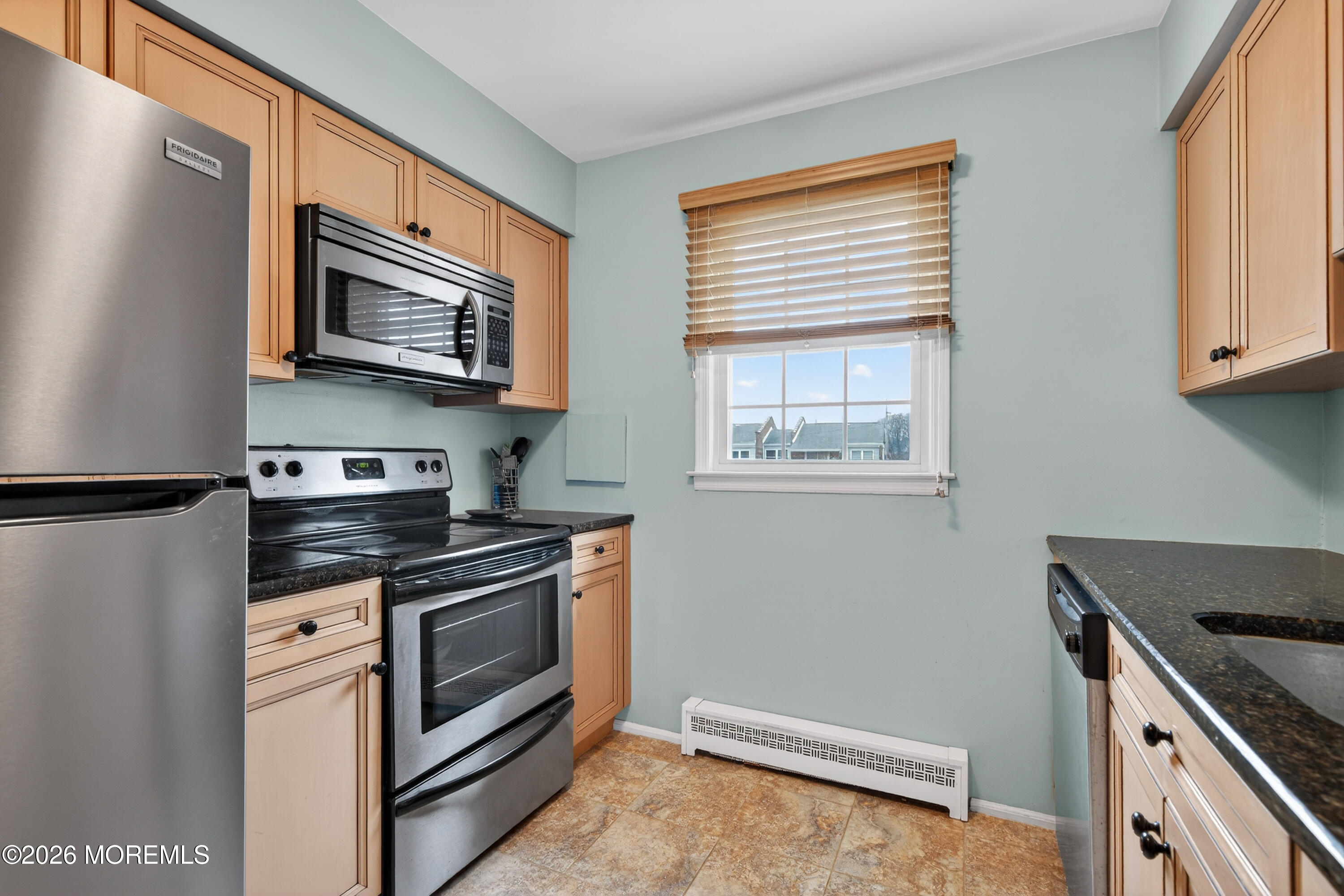 330 Highway 35, Unit 20 Point Pleasant Beach, NJ 08742 - Photo 11 of 22 a kitchen with stainless steel appliances a stove microwave and sink