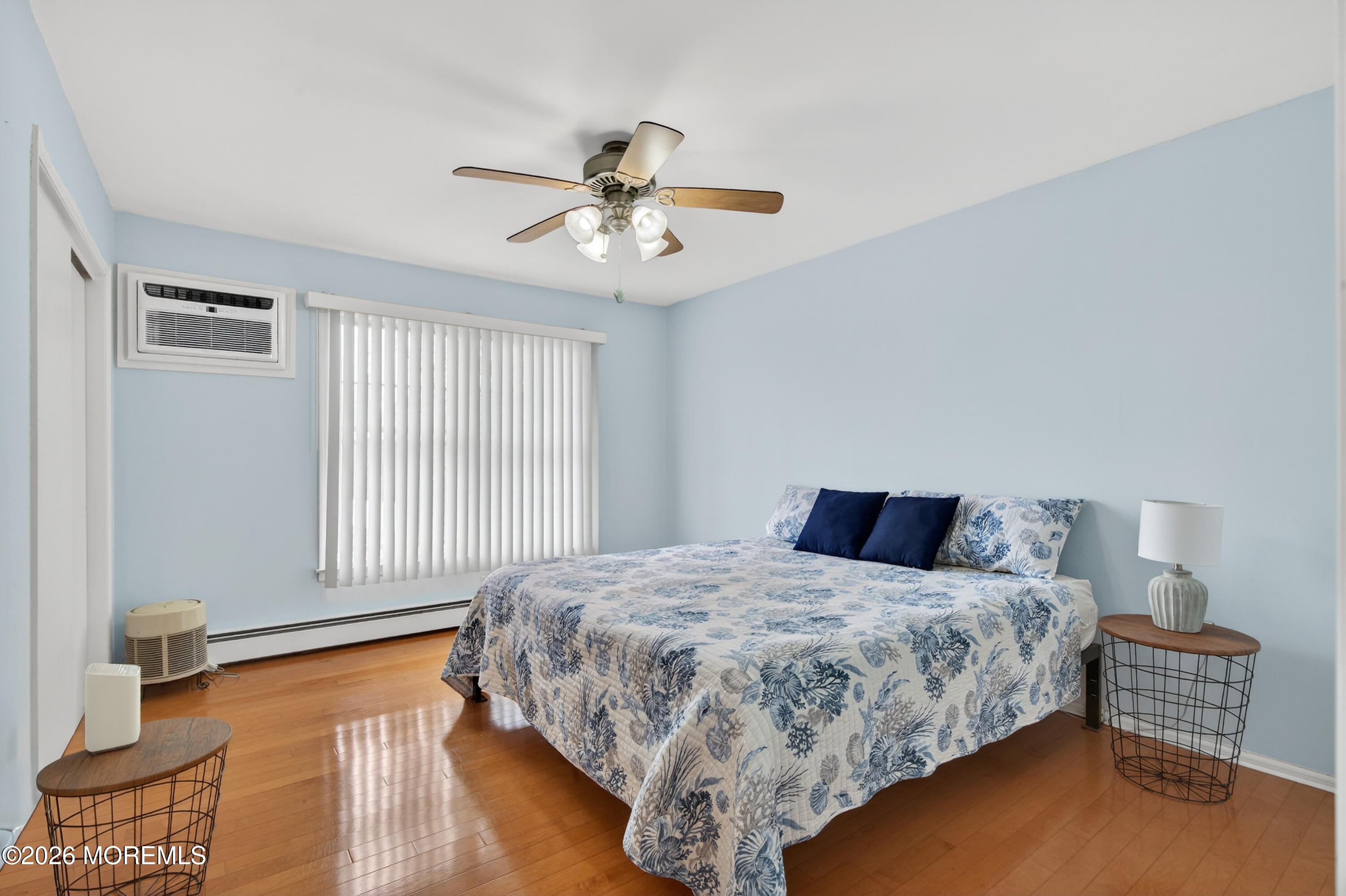 330 Highway 35, Unit 20 Point Pleasant Beach, NJ 08742 - Photo 14 of 22 a bedroom with a bed and wooden floor