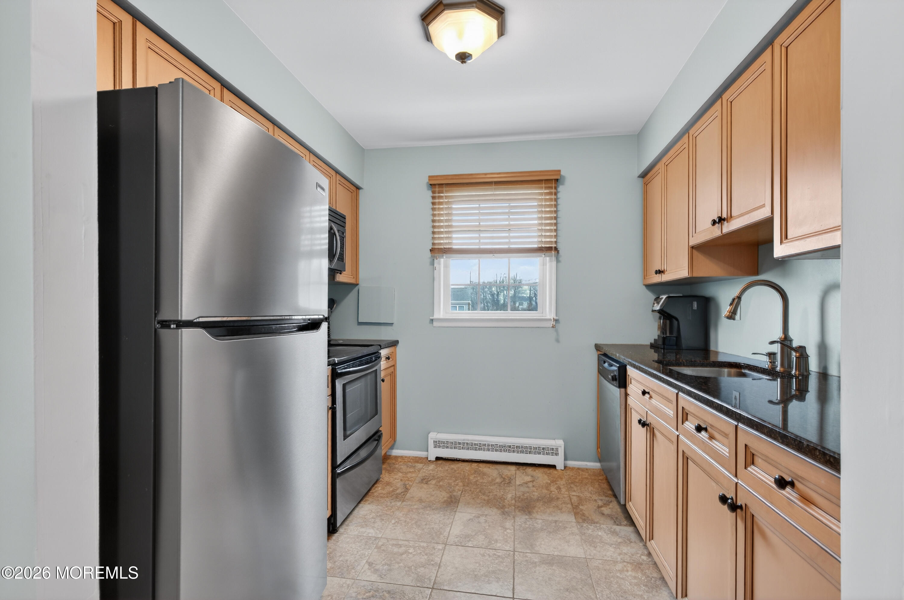 330 Highway 35, Unit 20 Point Pleasant Beach, NJ 08742 - Photo 9 of 22 a kitchen with stainless steel appliances granite countertop a refrigerator and a sink