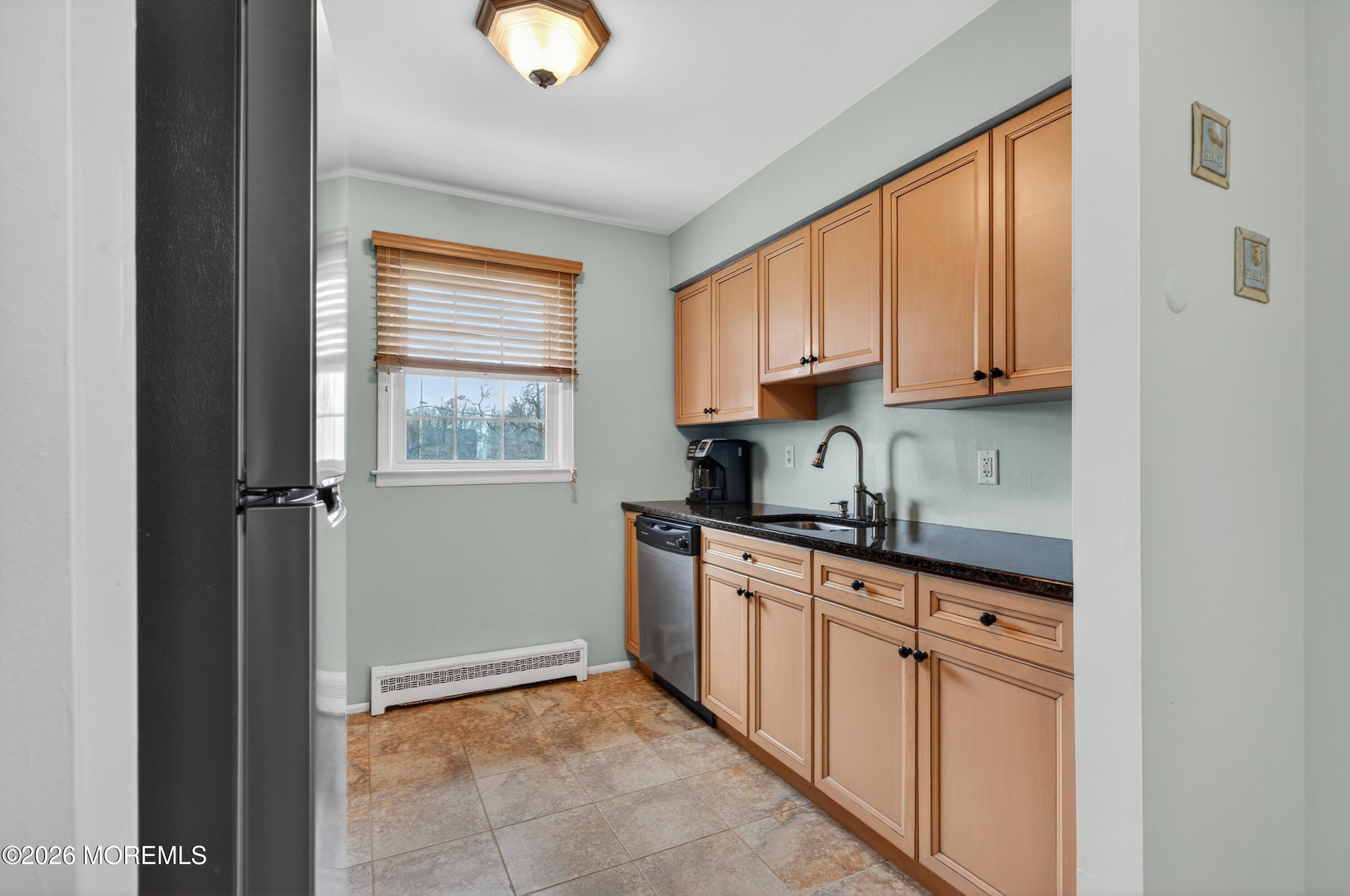 330 Highway 35, Unit 20 Point Pleasant Beach, NJ 08742 - Photo 10 of 22 a kitchen with granite countertop a sink window and cabinets