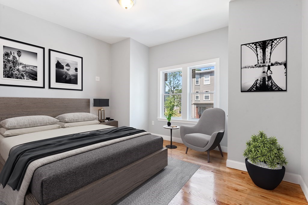 9 Wales Street, Unit 2 Boston, MA 02124 - Photo 6 of 15 a bedroom with a bed and wooden floor