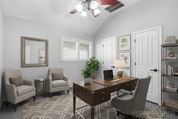 a living room with furniture and a window