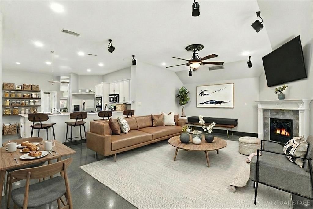 12701 Beech Tree Lane Fort Worth, TX 76040 - Photo 26 of 33 a living room with fireplace furniture and a flat screen tv