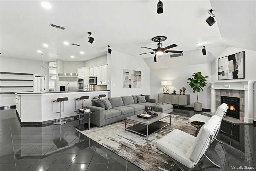12701 Beech Tree Lane Fort Worth, TX 76040 - Photo 27 of 33 a living room with furniture kitchen view and a chandelier