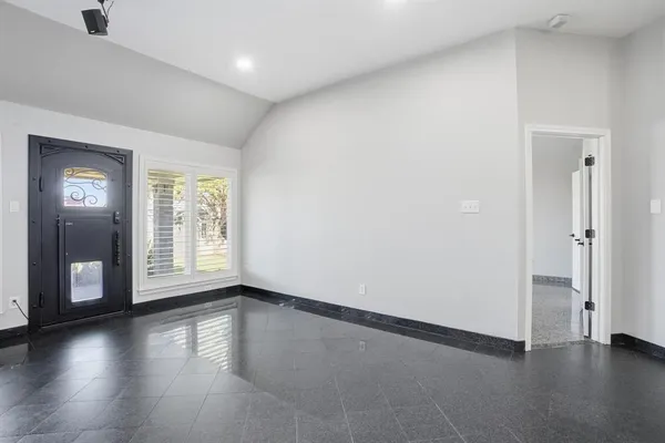 a living room with furniture kitchen view and a chandelier